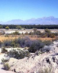 View across Rio Grande Valley from a pithouse village located on an alluvial fan near Los Tules, New Mexico. Organ Mountains in background.