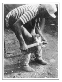black and white photo of a man using a clinching bar