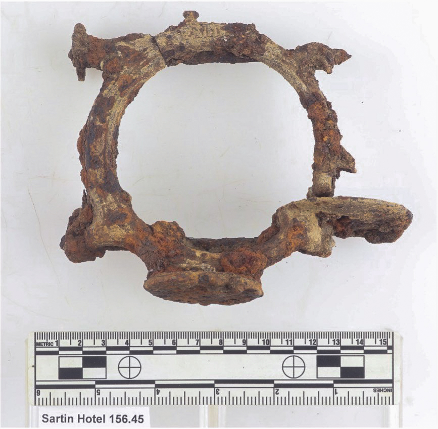 color photo of a small sewing machine covered in concretions