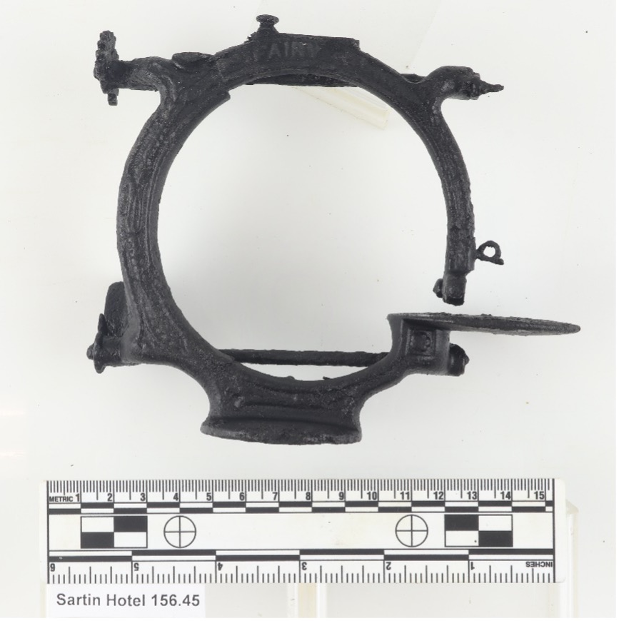 side view photo of small hoop-shaped sewing machine