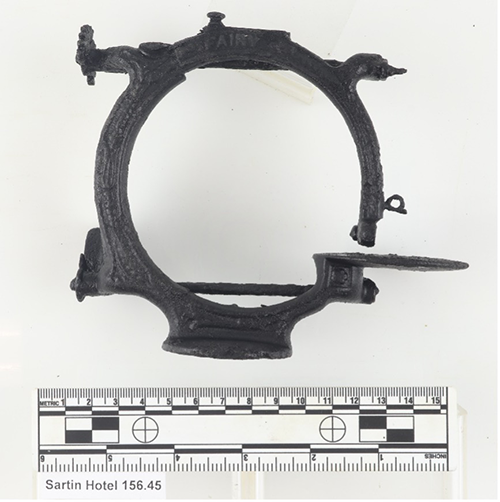 side view photo of small hoop-shaped sewing machine