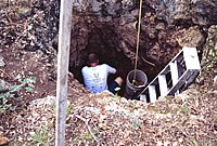 Case Mumpire digs within the narrow confines of the sinkhole.