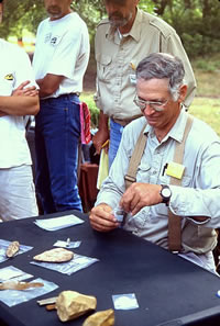 Gault Project Director Dr. Michael B. Collins enjoys a pun while introducting TAS volunteers to Clovis lithics.