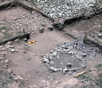 The dark-stained ring of rocks shown here is the central pit of a small 