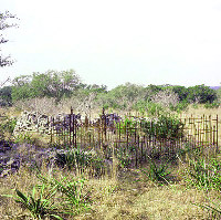 Ruins of an early settler's cabin, prior to restoration by current landowners. Photo by Susan Dial.