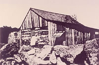 Photo of the house circa 1915. The frame sleeping porch extends across the front of the house and the kitchen has been added to the rear. Courtesy Fred Haas.