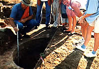 crew members around a well