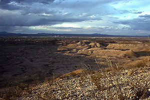 photo looking northeast from a gravel-topped high terrace on the Mexican side across the Presidio Bolson