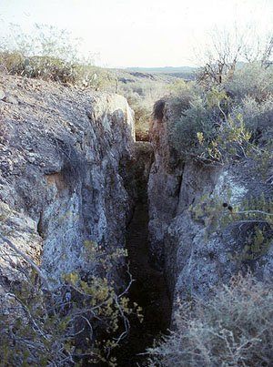 photo of a hand-dug irrigation canal along the Rio Grande near the Polvo site