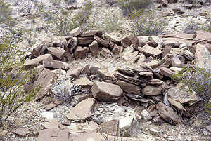 photo of a stacked-stone foundation of a circular wickiup