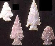 photo of arrowheads on black background