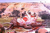PaleoIndian peoples butchering a mammoth.