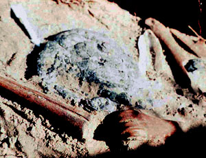 Image of Enlarged area of photo taken by Lou Fullen of grave offerings above the chest area of Burial 10.