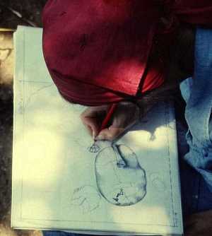 Image of a partially exposed burial in June, 1976.