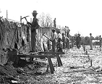 WPA crew excavating through mound.