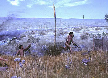 Rabbit-stick welding boys chase rabbits toward a net fence and a certain fate. Mural and diorama scene by artist Nola Davis, courtesy of Texas Parks and Wildlife Department.