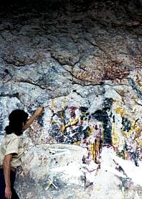 Art history researcher Penny Lindsey traces Pecos River style pictographs onto a clear sheet of acetate in 1963. Direct tracing is thought by some to be the most accurate, albeit cumbersome, method of copying pictographs. Photo from ANRA-NPS Archives at TARL.