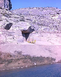 Arenosa Shelter was chosen for excavation because of its location on a low terrace of the Pecos River. The 1965-1968 hand and mechanical excavations there documented about 50 layers alternating between periods of occupation and major flood deposits. These deposits date back to over 10,000 years ago. Photo from ANRA-NPS Archives at TARL.