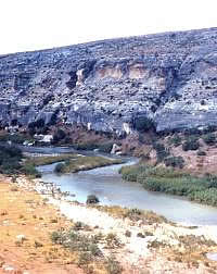 The Pecos River is shallow and mineral-rich. Its source lies hundreds of miles to the north in New Mexico. Photo from ANRA-NPS Archives at TARL.