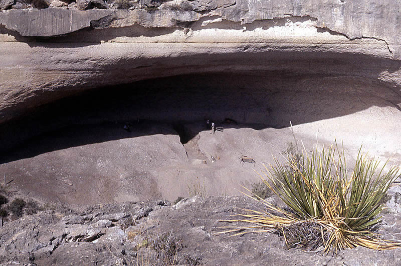 a large cave in a cliff