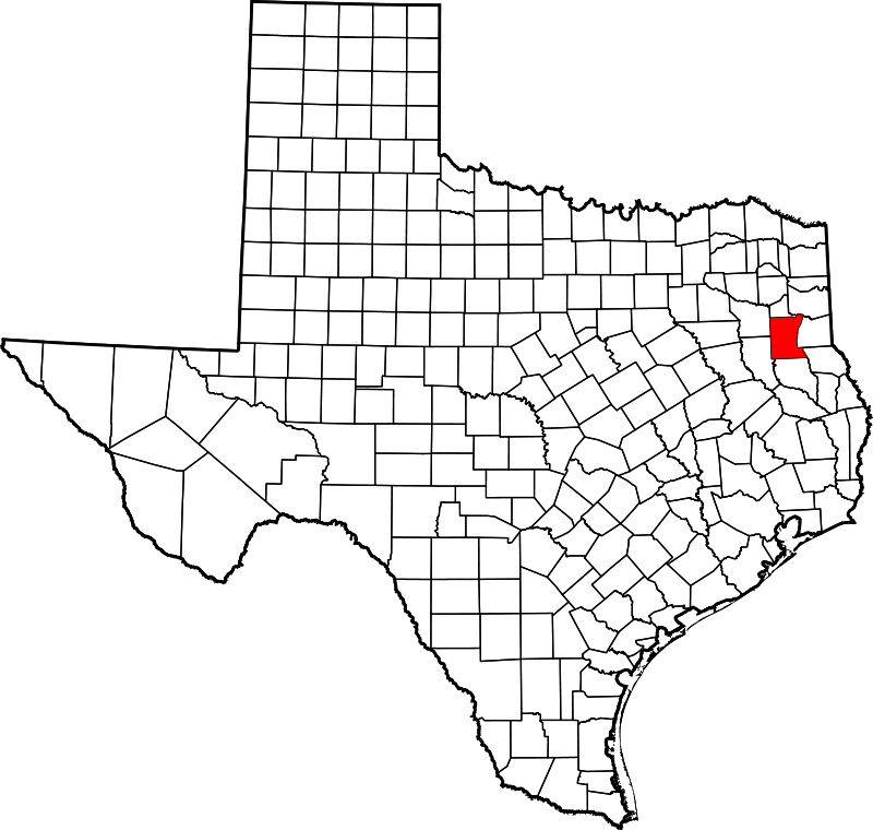 The outline of Texas counties. Black and white except for Rusk County, in red.
