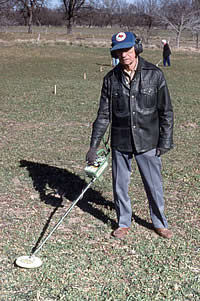 Tommy Tomesal, leader of a group of metal detector operators, all members of the Southern Texas Archeological Association. Tomesal's group used their metal detectors very productively to locate a number of musketballs, nails, brass artifacts, and other Spanish metal artifacts across the mission site. 