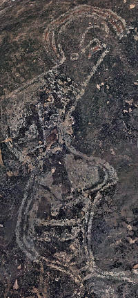 photo of a pecked depiction of a horned, plumed serpent