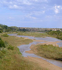 Photo of shallow river and dry valley.