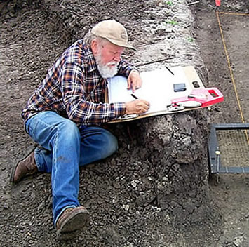 Photo of Curtis Tunnell creating a map in the field