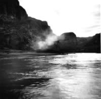 photo of smoke rising over a river