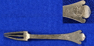photo of a pewter three-tined fork