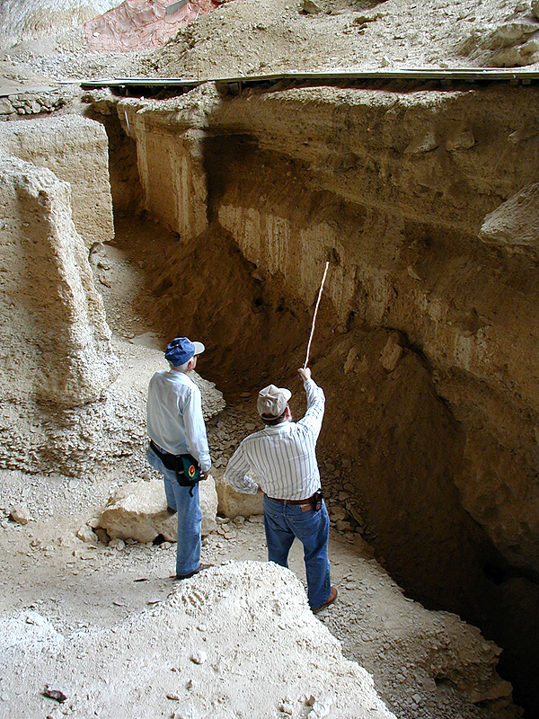 Elton points out to Jack places where the main excavation walls have recently slumped.