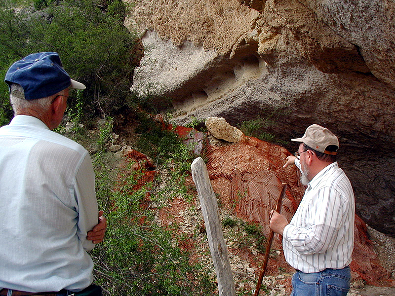 Elton Prewitt points out areas where more protective material is needed to Jack Skiles.