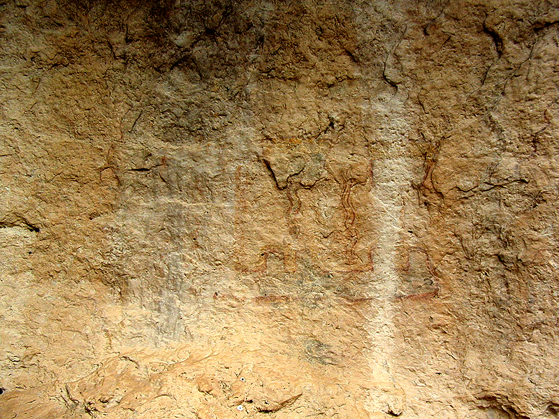 Close up of pictographs at Kelly Cave. These paintings were created over 3,500 years ago. Most are thought to be symbolic expressions of the sacred rituals and beliefs of Lower Pecos peoples.