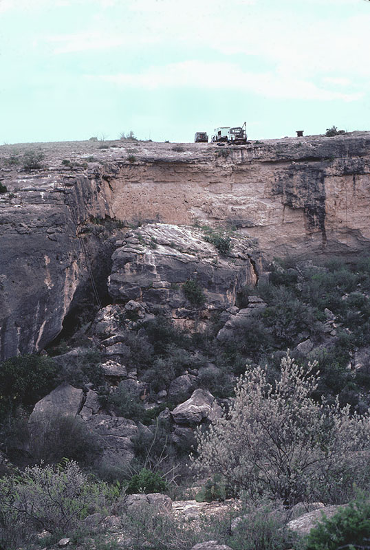 View of Bonfire from opposite canyon wall, 1983. Winch and generator trucks are parked at edge of cliff. Photograph by Solveig Turpin. 