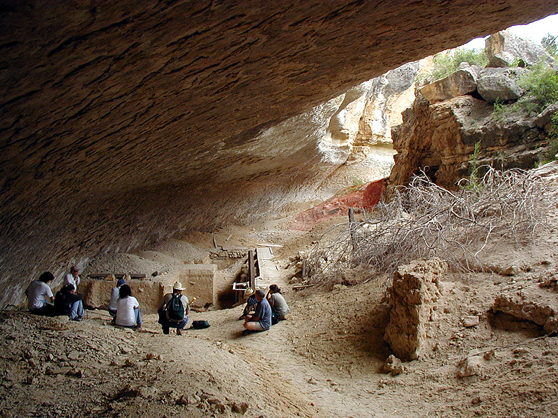 View of central area of Bonfire Shelter from the north. The massive rock pile (fallen roof blocks) upon which most the bison fell is visible on the right.