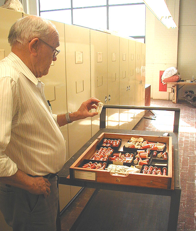 Lundelius examines vial containing microfauna from Bonfire. Photo by Steve Black.