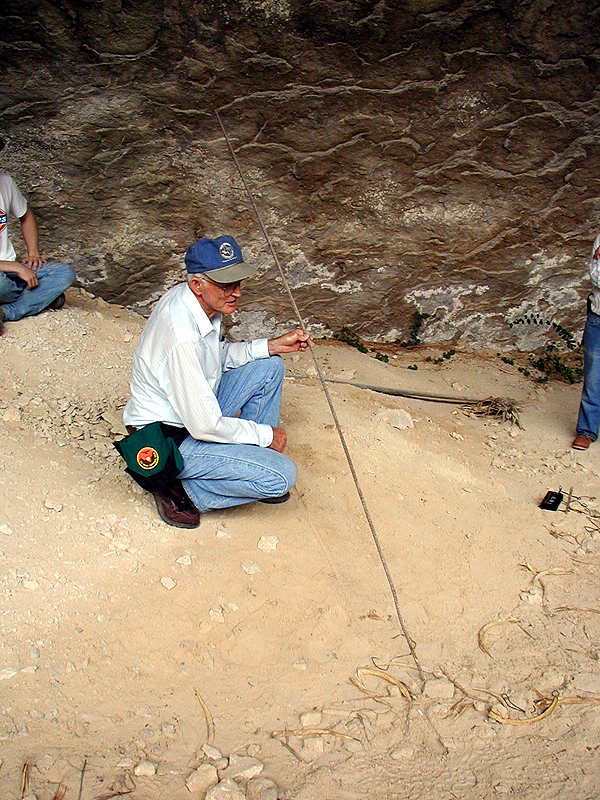 Jack Skiles holds the welded rebar he used to probe below the deepest excavations at Bonfire Shelter.