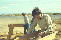 Dr. Vern Scarborough, then of UT El Paso, now of the University of Cincinnati, works with some of his students at Firecracker Pueblo. Students in anthropology courses used collections from the site in research projects and received extra credit for assisting in the excavations