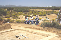 Members of the El Paso Archaeological Society admiring a job well done at the end of the day. In the foreground is a nice pueblo room. 