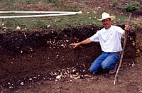While TAS members dug mightily in search of Clovis artifacts, landowner Ricky Lindsey walked up to an exposed provile. 