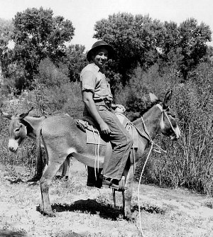 photo of J. Charles Kelley astride a mule