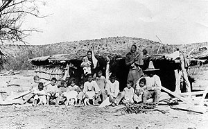 Historic photograph, ca. 1900-1910, that J. Charles Kelley labeled “La Junta type jacal structure with occupants, Redford area.” 