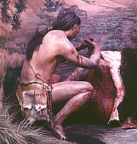 man butchering bison