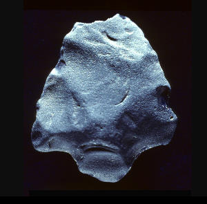 photo of an unidentified fragmentary projectile point made of obsidian