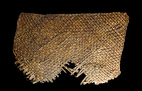 Fragment of a large mat woven out of yucca fibers. Such mats were common in the Lower Pecos and probably helped keep food items free from cave dust. From the ANRA-NPS collections at TARL.