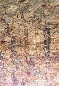 Pecos River style pictographs in Rattlesnake Canyon. One of the serpentine "rattlesnakes" can be seen to the left of the dark shaman figure. Photo by Steve Black.