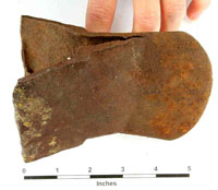 photo of worn out old axe found ont he farm