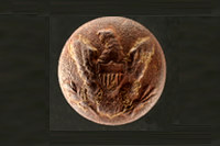 photo of a metal button with an eagle's head