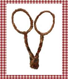 photo of a rusty handles of a pair of sewing scissors.